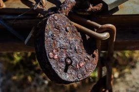 Old rusty lock on fence