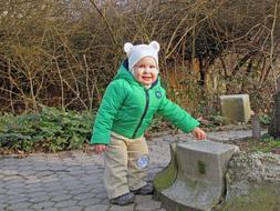 smiling child at rock