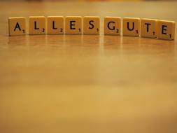 wooden cubes lined up in the word