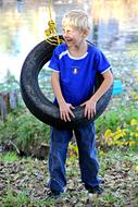 boy on a tire swing