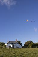 Kite Flying over Cottage