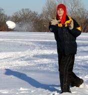 boy throwing snowball