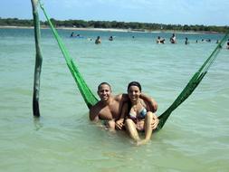 man and girl vacationing at the sea