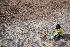 Child Playing In Sand Little Girl