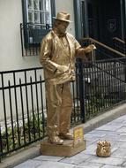 golden sculpture on the street