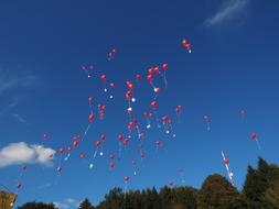 balloons a lot sky clouds