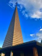 a tall building with a blue sky