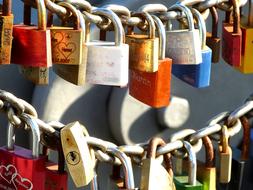 colorful wire locks on the fence.