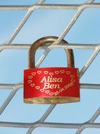 red lock on the fence