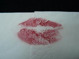 a passionate kiss on a napkin