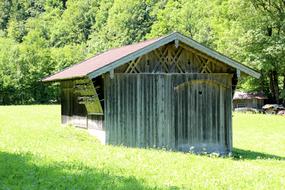 the old barn is green in the village