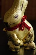 golden bunny with a red bow