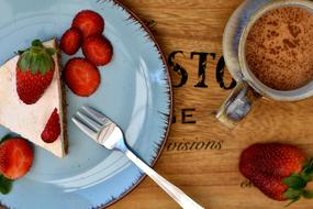 strawberry cake and cup of cocoa