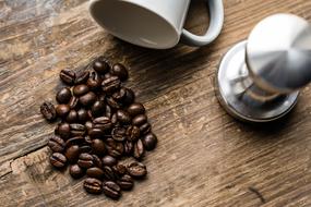 coffee beans and dropped cup as a still life