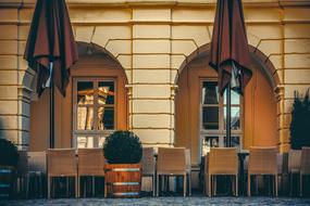 Beautiful and colorful weinstube with the chairs, tables, plants and parasols outdoors, in Freiburg, Germany