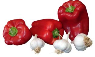 red paprika and garlic on white background