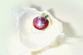 strawberry in white liquid