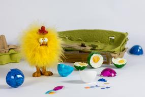 easter decorations of chicken toy and colorful eggs