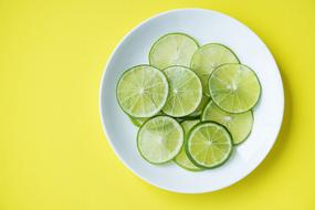 sliced lime on a white plate