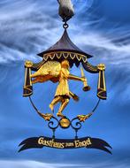 Gasthaus Zum Engel, vintage wrought iron street sign at sky