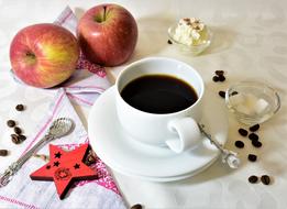 cup of coffee and two red apples for breakfast