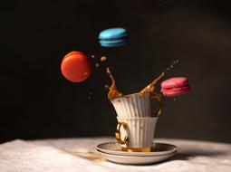 splashes of coffee and macaroon cakes