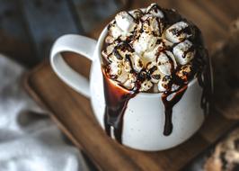 hot chocolate with white marshmallows in a white cup