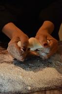 Person, cooking bread with sugar, in hands