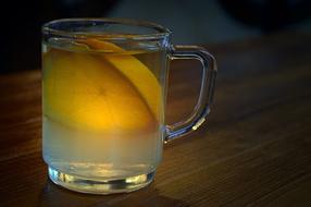 mulled wine with lemon in a transparent cup