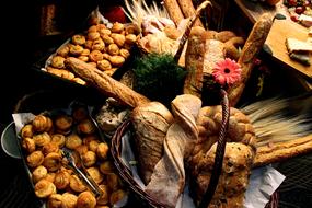 Beautiful and colorful still life with the different, baked food in the baskets