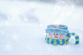 cup with coffee in the snow