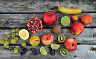 Colorful Tasty Fruits on wood