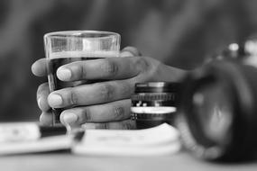 cup with coffee in hand in black and white image