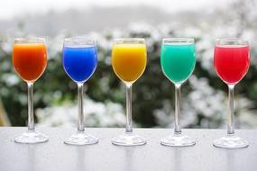 multi-colored cocktails in glasses
