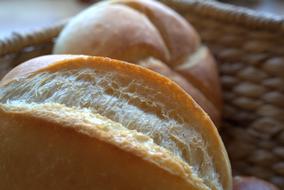 fresh bread in a wicker breakfast basket close-up