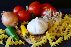 red tomatoes with pasta and garlic