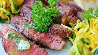 beef steak in marinade in herbs