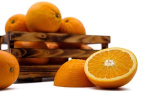 photo of ripe oranges in a wooden box