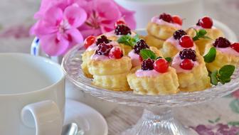 Puff Pastry cakes with berries on glass stand