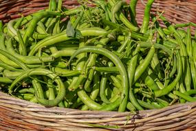 wicker basket with green beans close-up