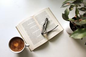cup of coffee and a book for a cozy stay