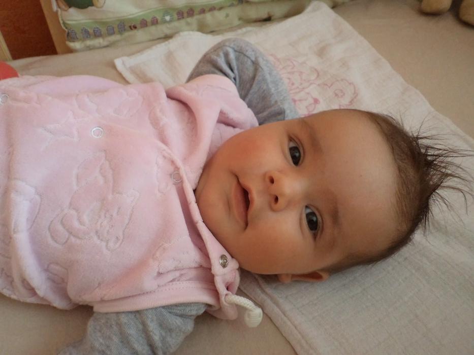 newborn in pink romper