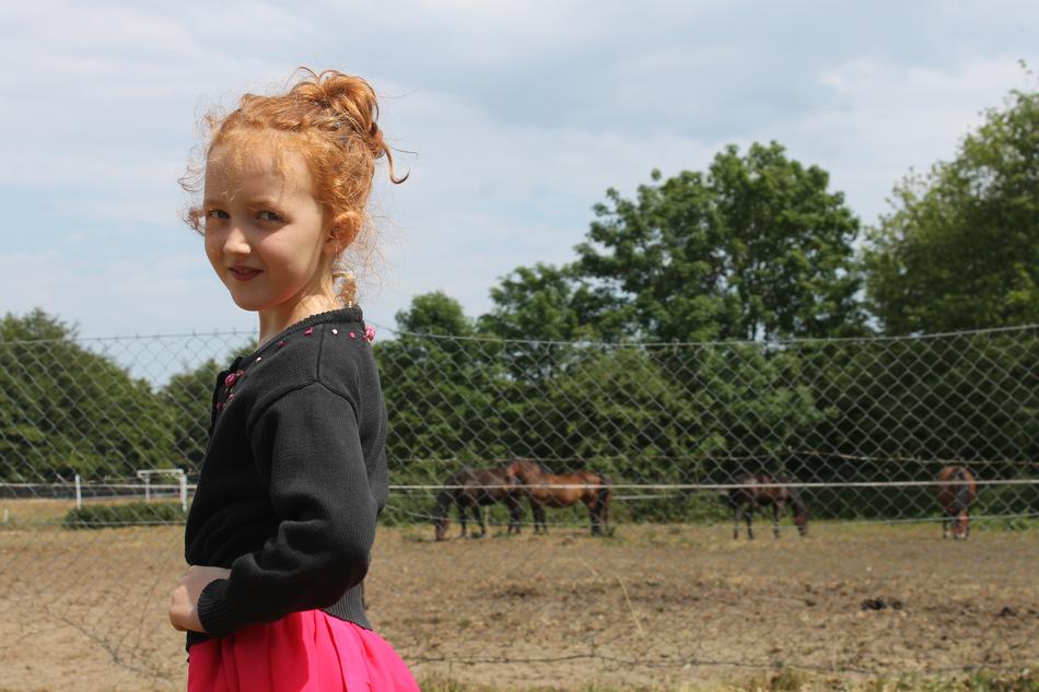 red-haired girl in the stable, poland