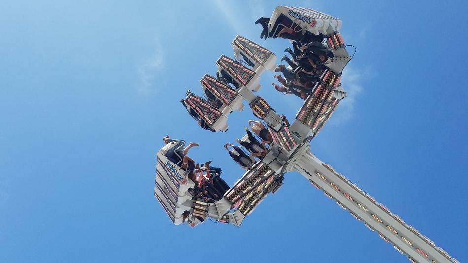people at the top of the rollercoaster