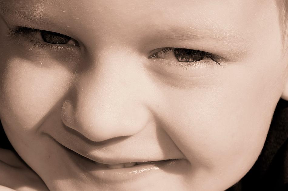 closeup photo of smiling boy eyes