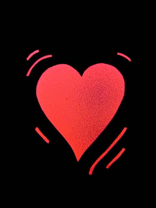 red heart on black background