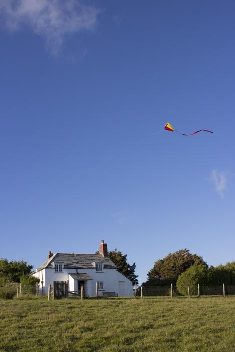 Kite Flying over Cottage
