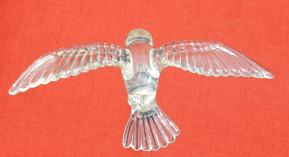 glass bird on a red background
