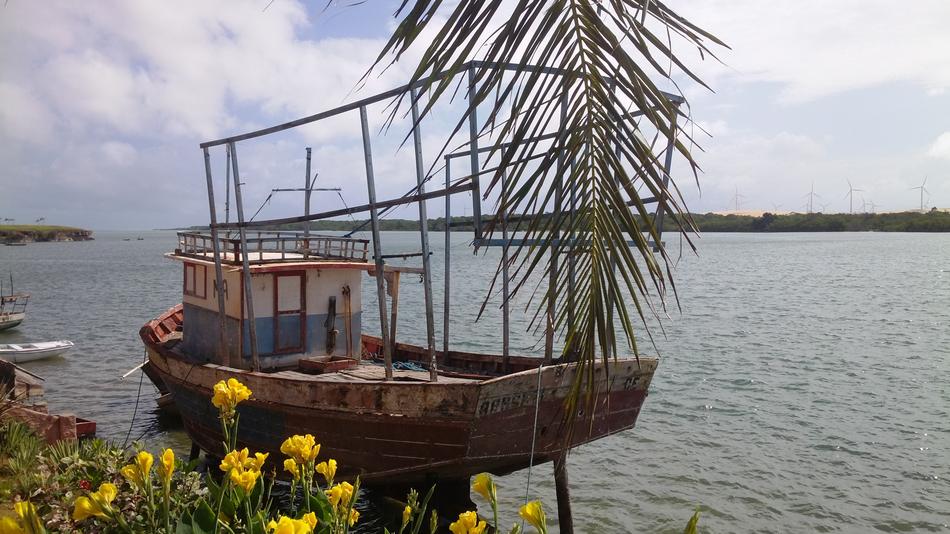 wooden boat with flowers in the sea