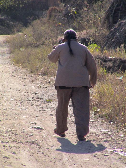 old woman on the road